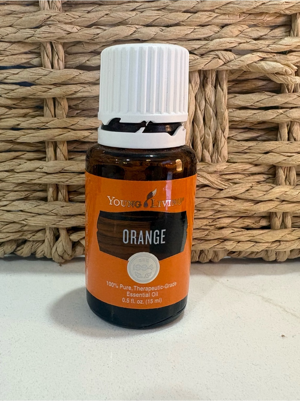Young Living Orange Essential Oil Bottle with White Cap and Orange Label
